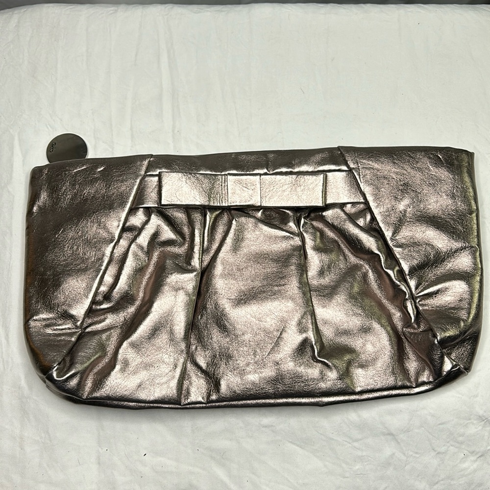 THE LIMITED metallic colored clutch handbag.